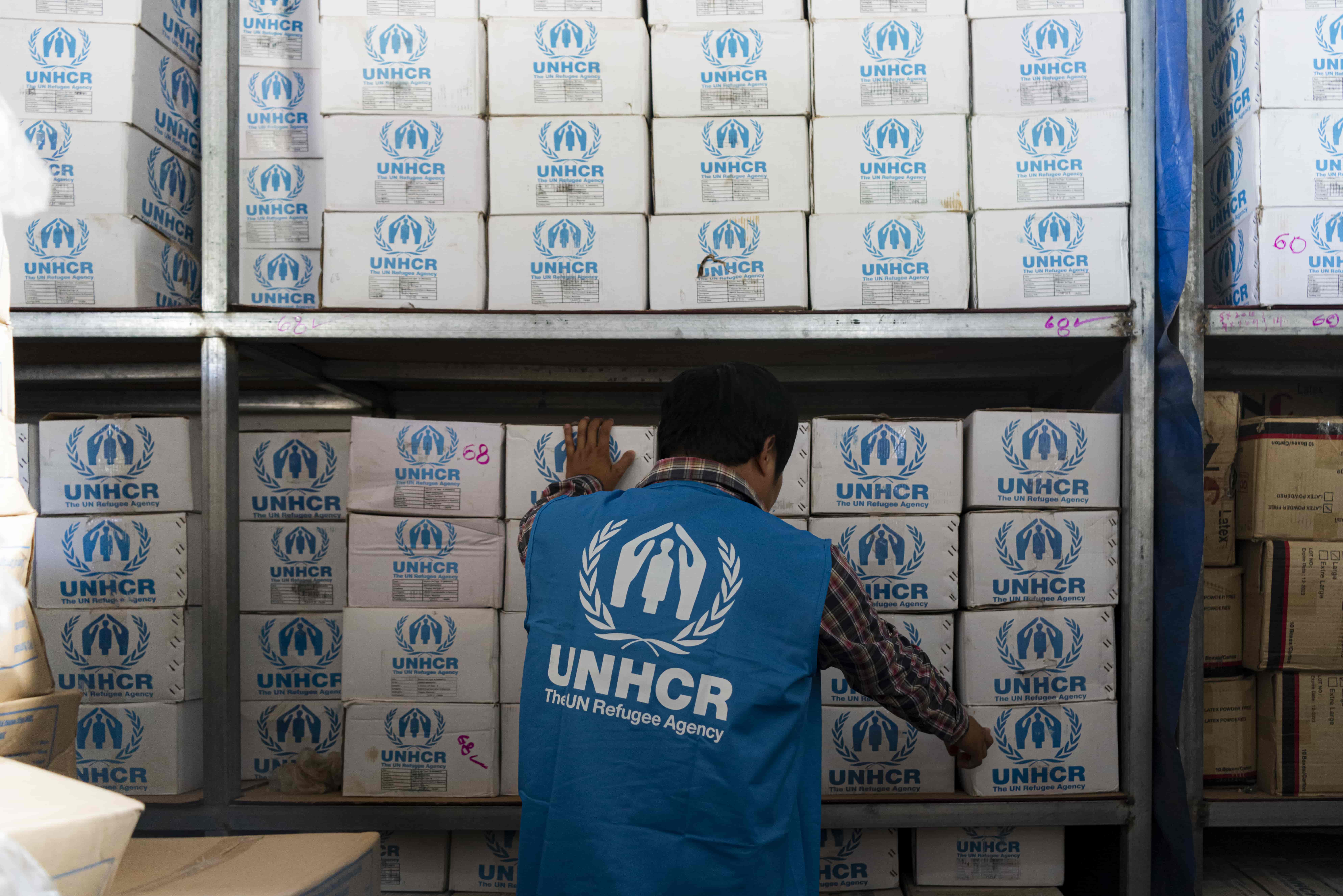 A UNHCR worker prepares the aid for survivors of the Myanmar earthquake.