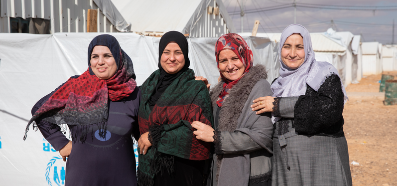 Four women apart of the Jordan Artisan Collective stand together  