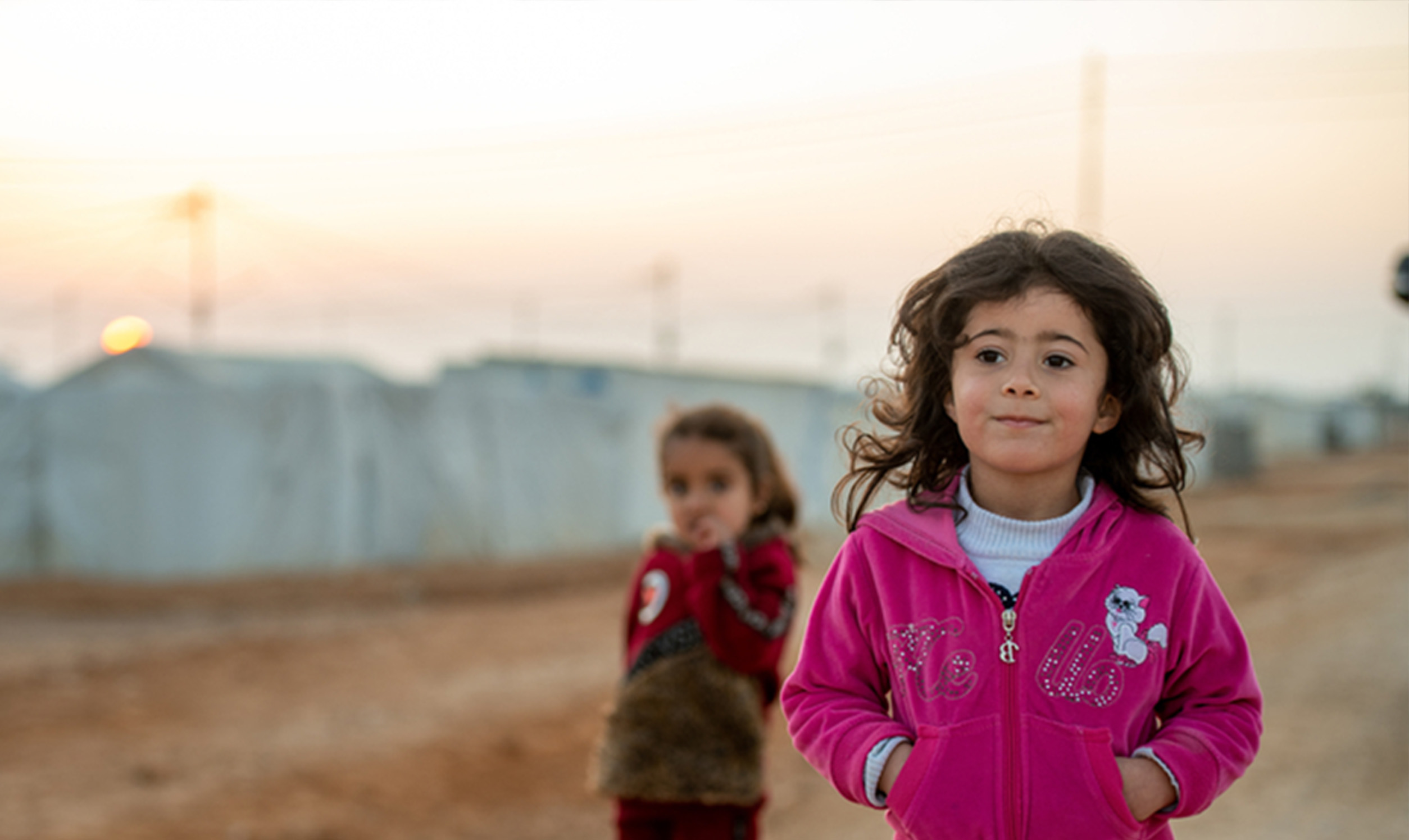 Syrian refugee children play in the streets in Azraq camp, Jordan.