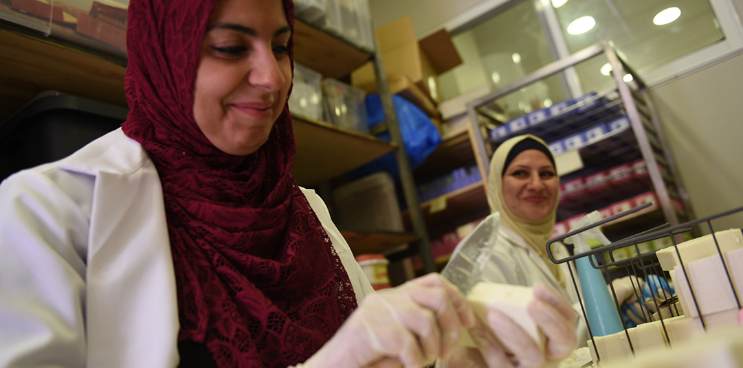 Women carve soap in Za'atari refugee camp to protect people from coronavirus