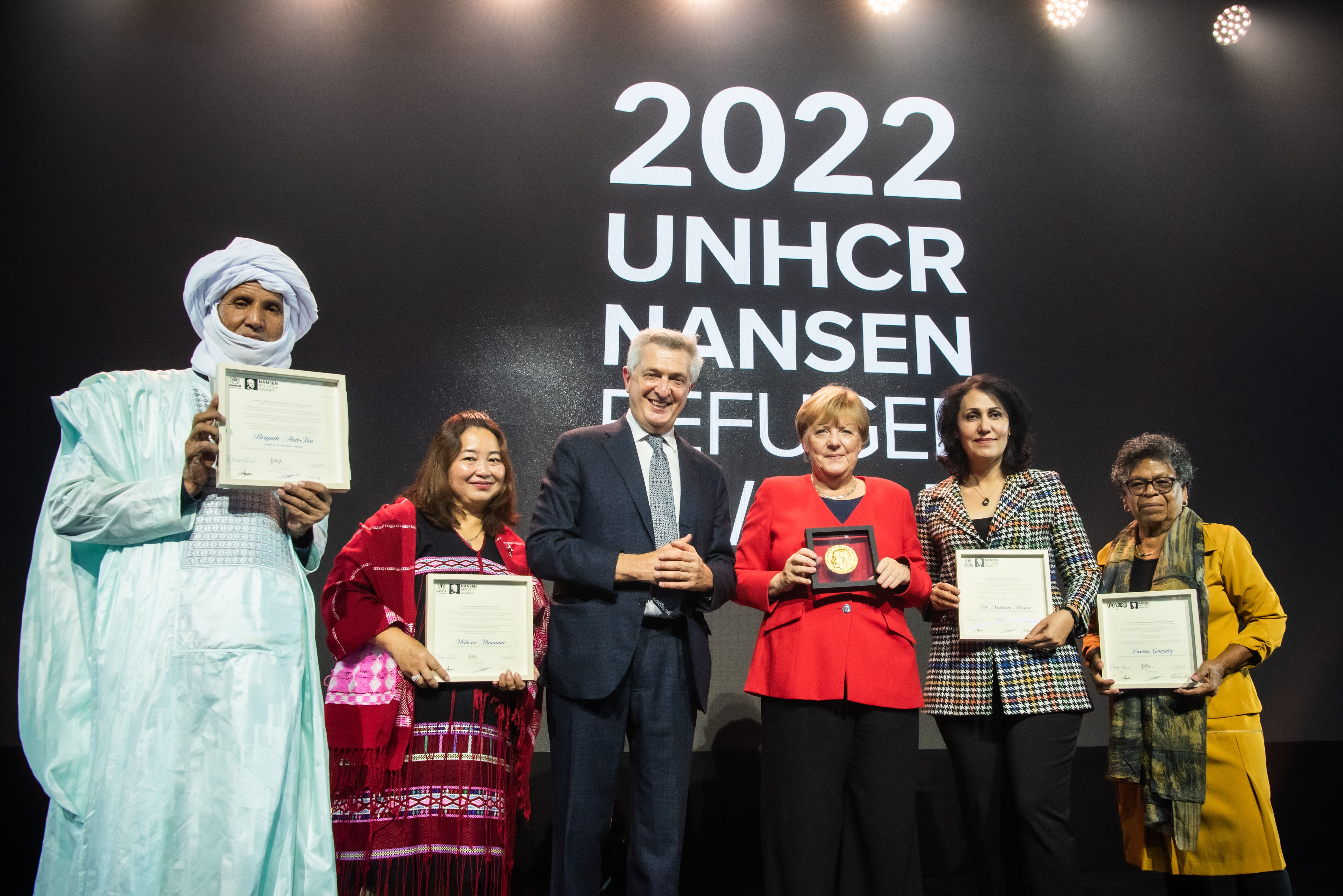 Former Federal Chancellor of Germany, Dr. Angela Merkel, who is the 2022 Nansen Refugee Award Global Laureate, along with UN High Commissioner for Refugees Filippo Grandi, poses for a photograph with this year’s Nansen Refugee Award Regional Winners.