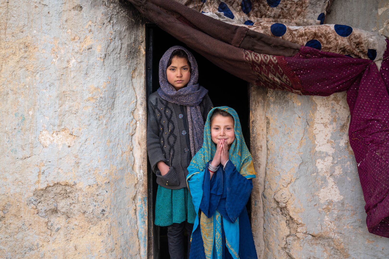 Farzana, 9, and Bibi Sherin, 6, live in Bamyan, where the freezing winter makes life even harder for their family.