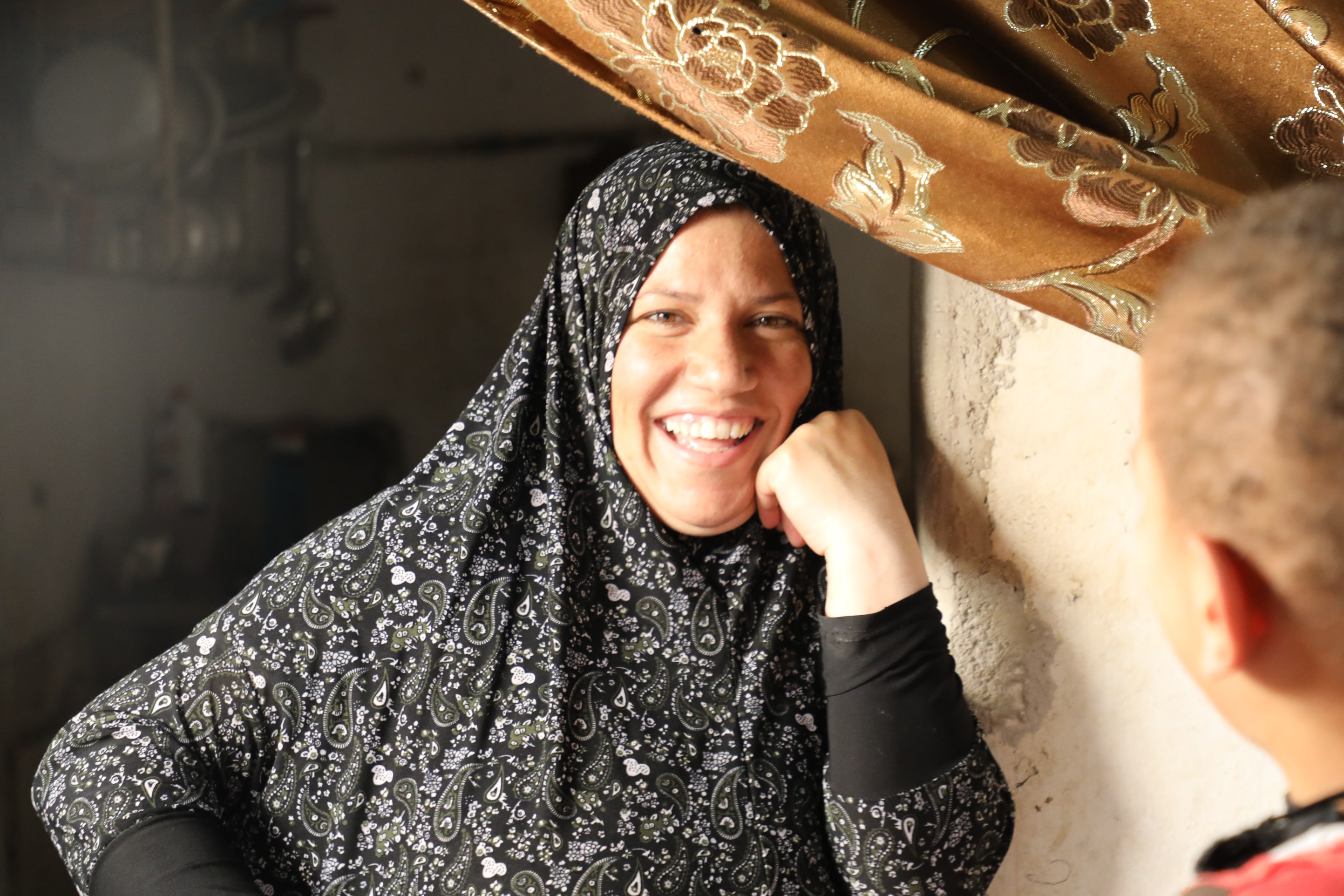 Zahra, a Syrian refugee with five children, is pictured at home in Mafraq 