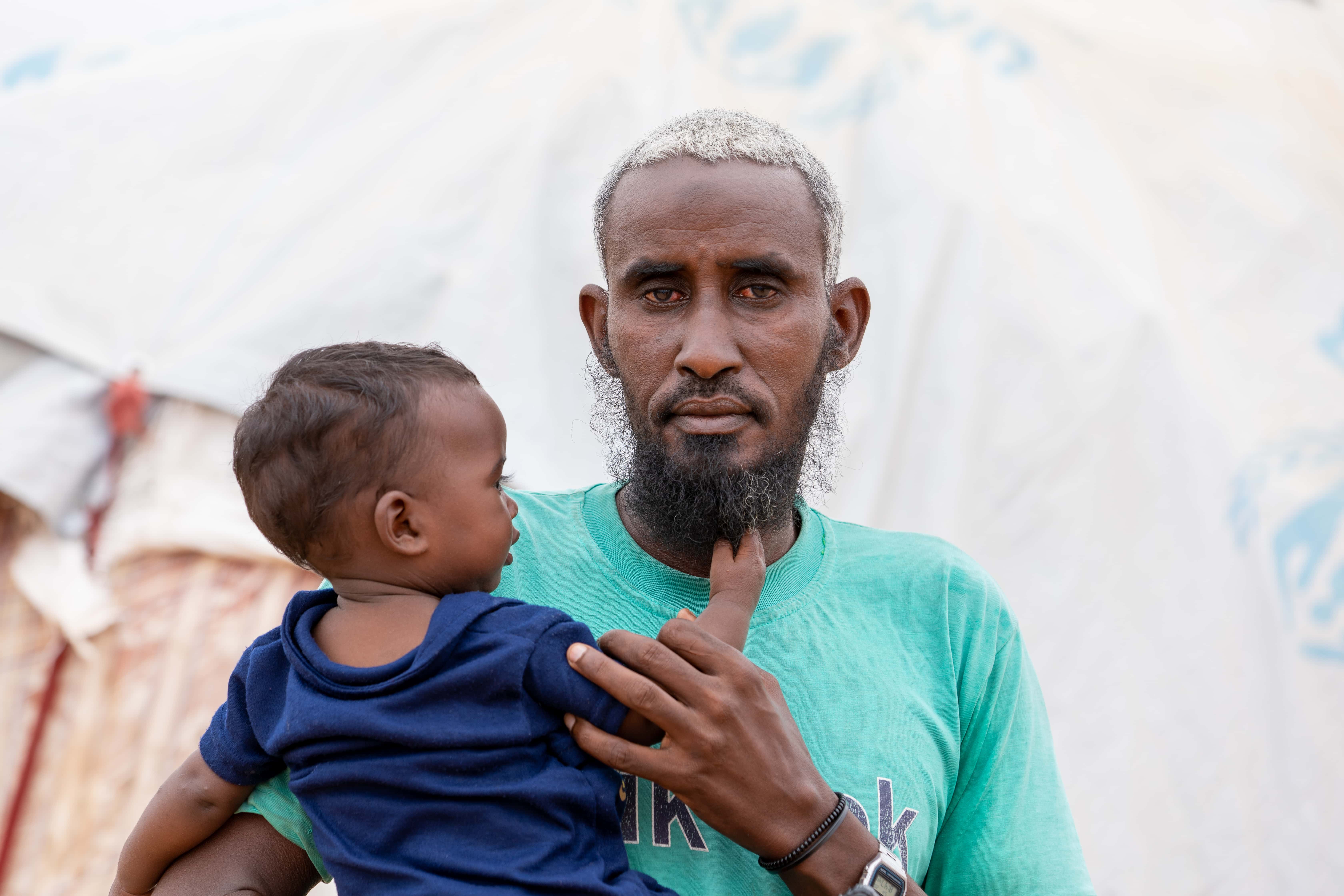 Somali refugees Hussein Abdi Ali and his six children fled to Kenya to escape the drought. 